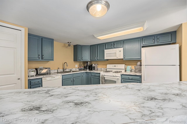 239 Fieldcrest St, Ann Arbor, MI 48103 - kitchen with white appliances and light stone counters