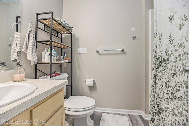 239 Fieldcrest St, Ann Arbor, MI 48103 - full bath with wood finished floors, vanity, and curtained shower