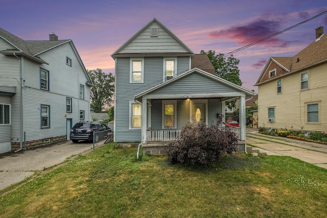 1607 Center Ave NE, Grand Rapids, MI 49505 - view of front of home featuring covered porch and a yard