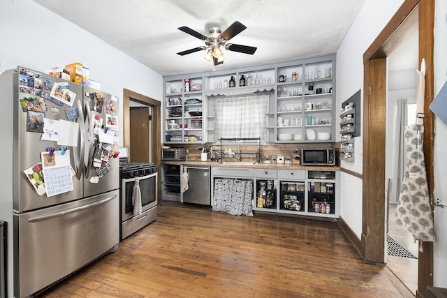 1607 Center Ave NE, Grand Rapids, MI 49505 - kitchen featuring stainless steel appliances, open shelves, ceiling fan, and dark wood-style floors