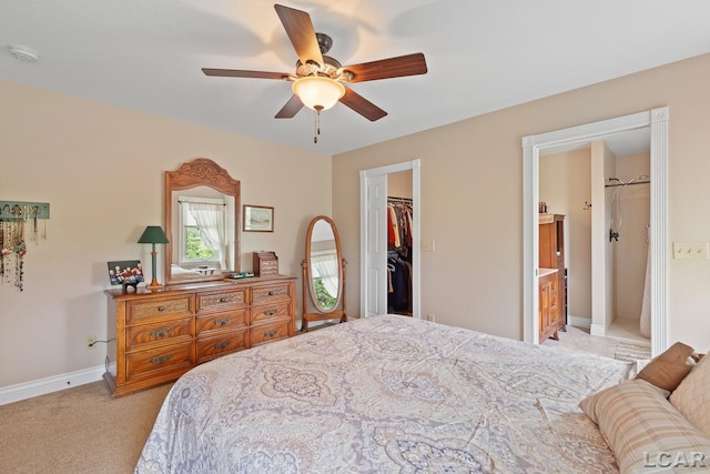 3224 Sand Creek Highway, Adrian, MI 49221 - bedroom with a walk in closet, a closet, light carpet, ceiling fan, and ensuite bath