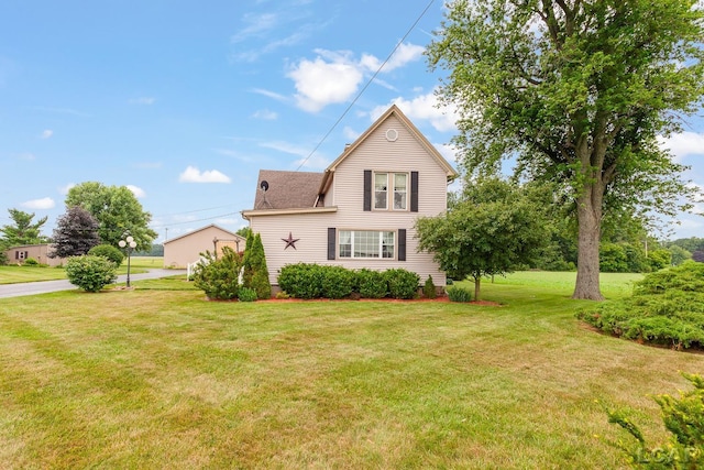 3224 Sand Creek Highway, Adrian, MI 49221 - view of side of home featuring a yard and a shingled roof