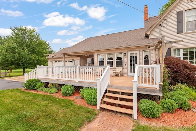 3224 Sand Creek Highway, Adrian, MI 49221 - wooden terrace with a yard and an attached garage