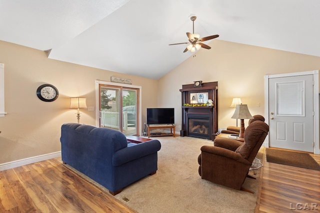 3224 Sand Creek Highway, Adrian, MI 49221 - living room with a ceiling fan, lofted ceiling, wood finished floors, and a glass covered fireplace