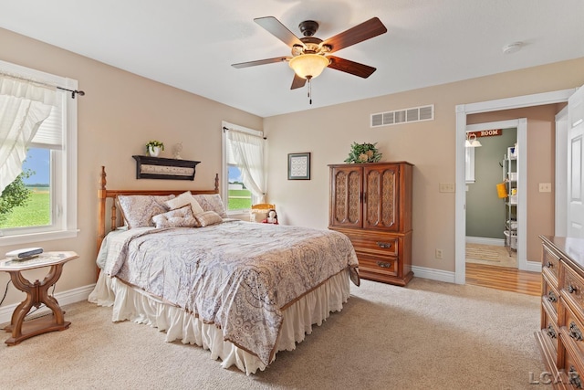 3224 Sand Creek Highway, Adrian, MI 49221 - bedroom featuring light colored carpet and ceiling fan