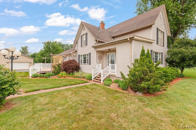 3224 Sand Creek Highway, Adrian, MI 49221 - view of side of property with a chimney, roof with shingles, and a lawn