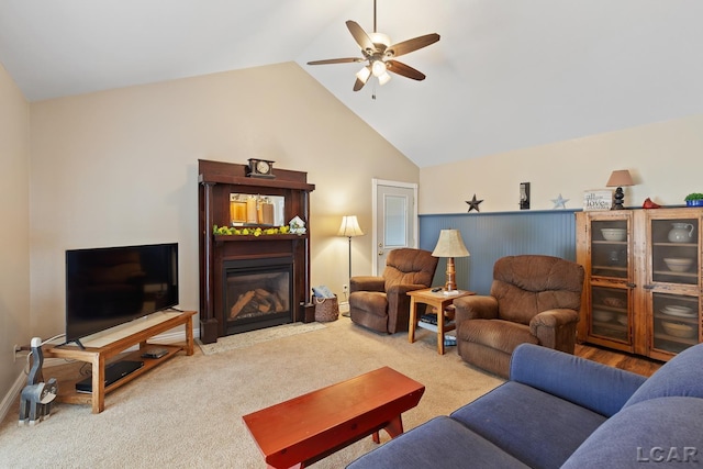 3224 Sand Creek Highway, Adrian, MI 49221 - living room with ceiling fan, vaulted ceiling, a glass covered fireplace, and carpet floors
