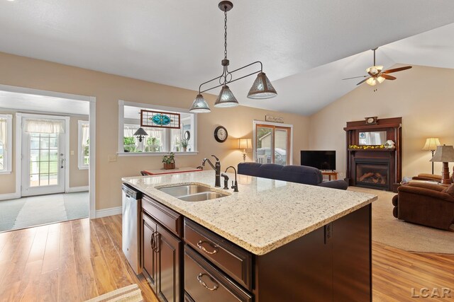 3224 Sand Creek Highway, Adrian, MI 49221 - kitchen featuring light wood-style floors, stainless steel dishwasher, dark brown cabinets, decorative light fixtures, and a ceiling fan