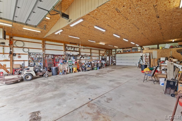 3224 Sand Creek Highway, Adrian, MI 49221 - garage with a workshop area and a garage door opener