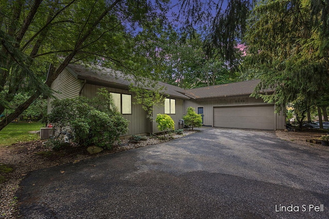 6636 E Riverwoods Ct NE, Rockford, MI 49341 - view of front facade featuring an attached garage and driveway