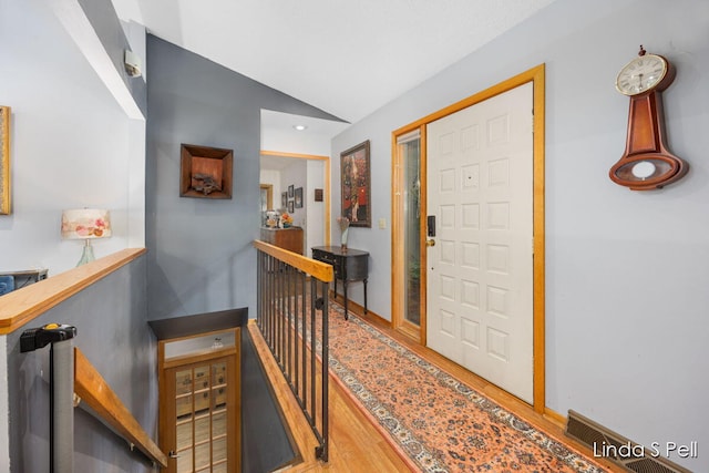 6636 E Riverwoods Ct NE, Rockford, MI 49341 - entrance foyer with wood finished floors and vaulted ceiling