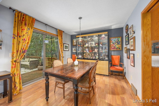 6636 E Riverwoods Ct NE, Rockford, MI 49341 - dining area featuring light wood-style flooring
