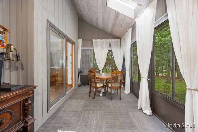6636 E Riverwoods Ct NE, Rockford, MI 49341 - sunroom featuring a skylight, vaulted ceiling, healthy amount of natural light, wood ceiling, and carpet floors