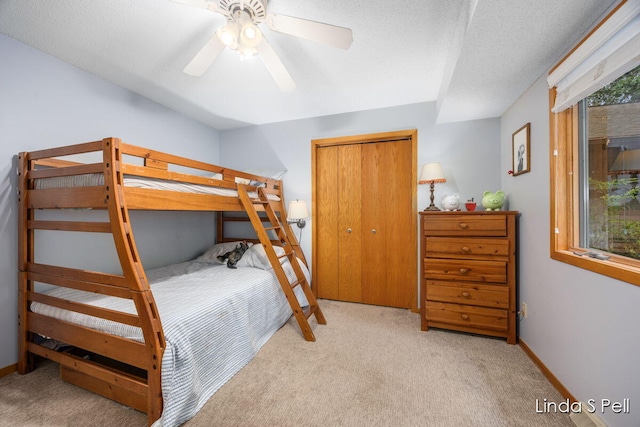 6636 E Riverwoods Ct NE, Rockford, MI 49341 - bedroom with carpet, a closet, and ceiling fan