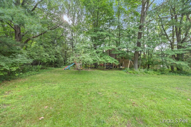 6636 E Riverwoods Ct NE, Rockford, MI 49341 - view of green lawn