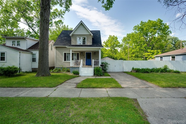 1217 E Madge Ave, Hazel Park, MI 48030 - bungalow with covered porch, concrete driveway, and roof with shingles