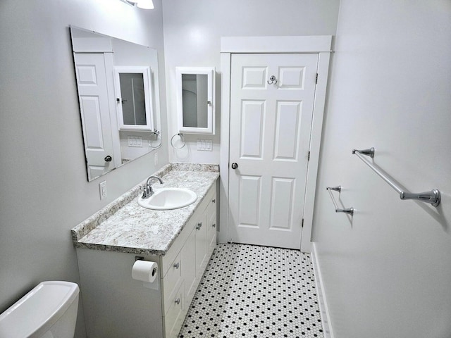 46 Lowell Ave NE, Grand Rapids, MI 49503 - bathroom featuring vanity and toilet