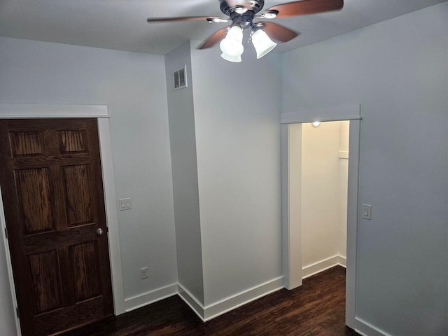 46 Lowell Ave NE, Grand Rapids, MI 49503 - unfurnished bedroom with dark wood finished floors and a ceiling fan