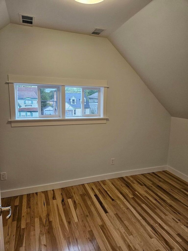 46 Lowell Ave NE, Grand Rapids, MI 49503 - additional living space featuring lofted ceiling and wood finished floors