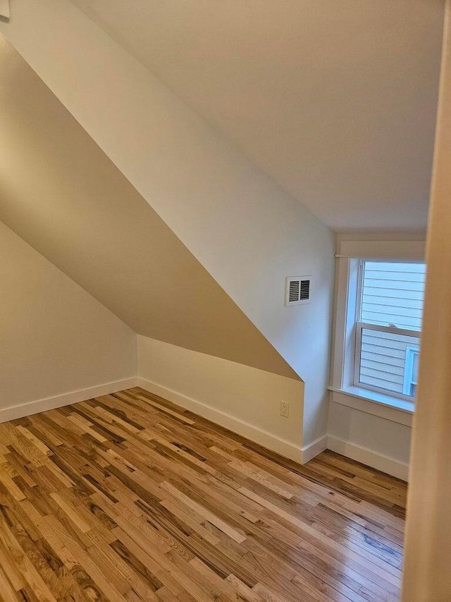 46 Lowell Ave NE, Grand Rapids, MI 49503 - bonus room featuring light wood-style flooring and vaulted ceiling