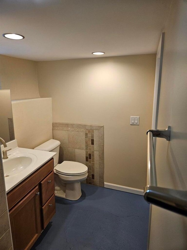 46 Lowell Ave NE, Grand Rapids, MI 49503 - half bathroom featuring vanity, tile walls, and recessed lighting