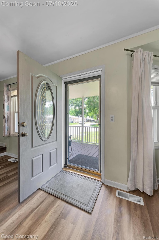 36149 Schley Ave, Van Buren, MI 48186 - entrance foyer with plenty of natural light, wood finished floors, and crown molding