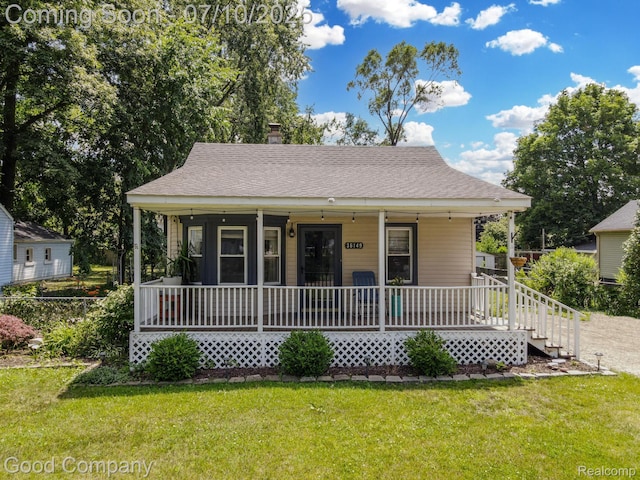 36149 Schley Ave, Van Buren, MI 48186 - view of front of property with a porch, a front lawn, and a shingled roof