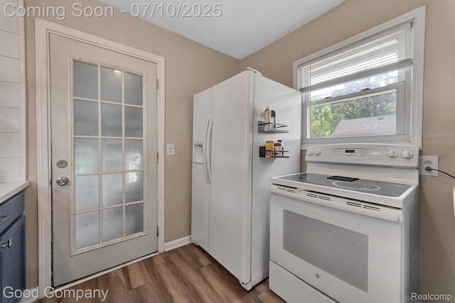 36149 Schley Ave, Van Buren, MI 48186 - kitchen featuring white appliances, blue cabinets, dark wood-type flooring, and light countertops
