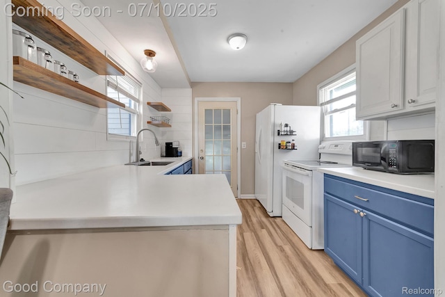 36149 Schley Ave, Van Buren, MI 48186 - kitchen featuring blue cabinetry, open shelves, white appliances, light wood-type flooring, and light countertops