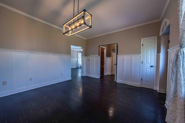 4433 Elm St, New Era, MI 49446 - empty room with dark wood finished floors, crown molding, a decorative wall, wainscoting, and a chandelier