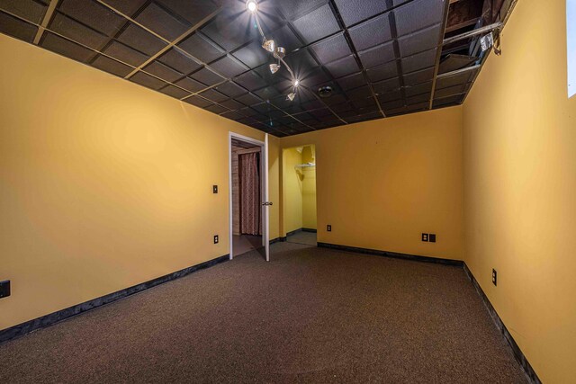 4433 Elm St, New Era, MI 49446 - empty room featuring carpet floors and baseboards