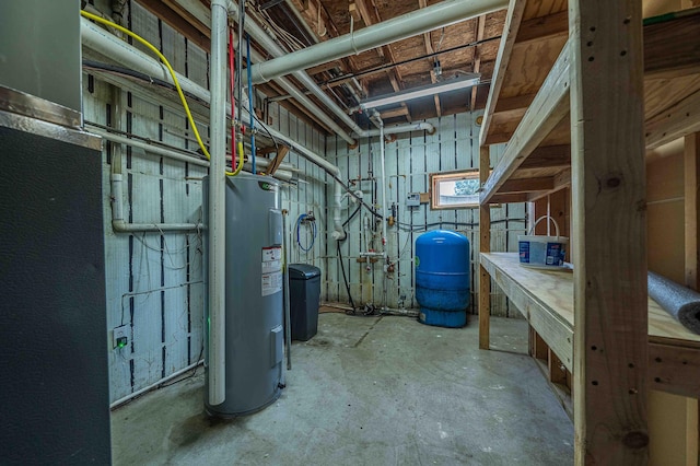4433 Elm St, New Era, MI 49446 - unfinished below grade area featuring electric water heater and a water pressure tank