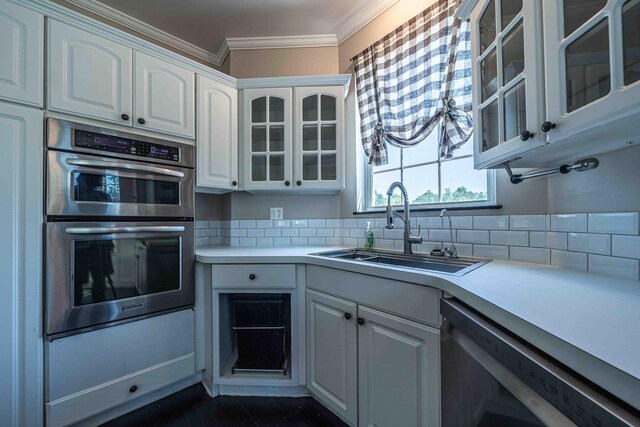 4433 Elm St, New Era, MI 49446 - kitchen with double oven, dishwashing machine, white cabinetry, ornamental molding, and light countertops
