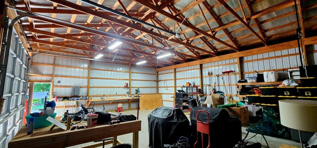 4433 Elm St, New Era, MI 49446 - garage featuring metal wall and a workshop area