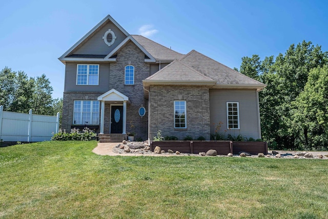 4433 Elm St, New Era, MI 49446 - view of front facade with brick siding and a shingled roof