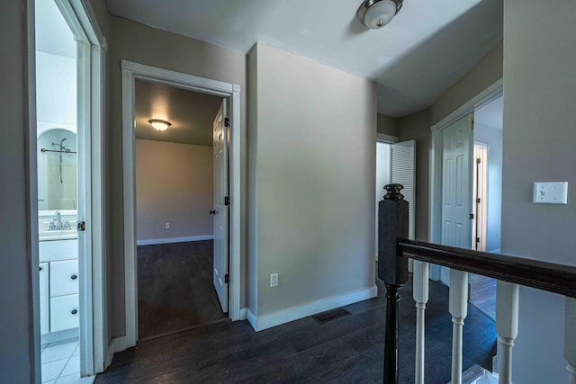 4433 Elm St, New Era, MI 49446 - corridor with dark wood-type flooring and a sink