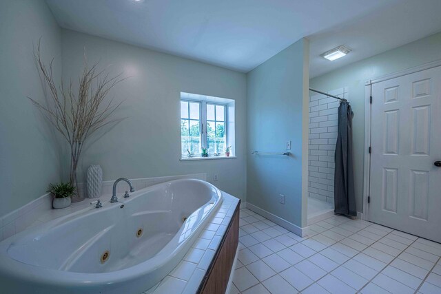 4433 Elm St, New Era, MI 49446 - full bath with a whirlpool tub, a stall shower, and tile patterned floors
