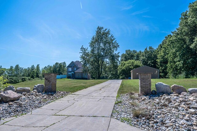 4433 Elm St, New Era, MI 49446 - view of concrete driveway