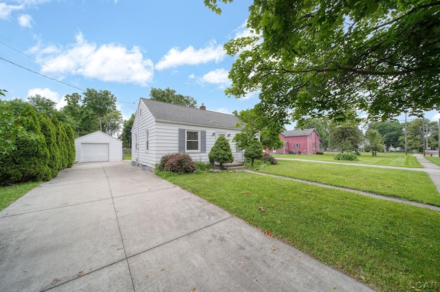 309 E Logan St, Tecumseh, MI 49286 - bungalow-style house featuring a detached garage, an outdoor structure, a front lawn, a chimney, and driveway