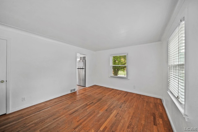 309 E Logan St, Tecumseh, MI 49286 - empty room featuring wood finished floors and baseboards
