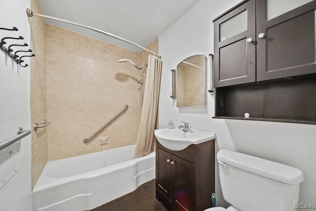 309 E Logan St, Tecumseh, MI 49286 - bathroom featuring shower / bathtub combination with curtain, vanity, and wood finished floors
