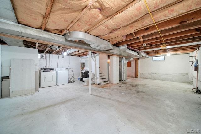 309 E Logan St, Tecumseh, MI 49286 - below grade area featuring washer and dryer and stairs