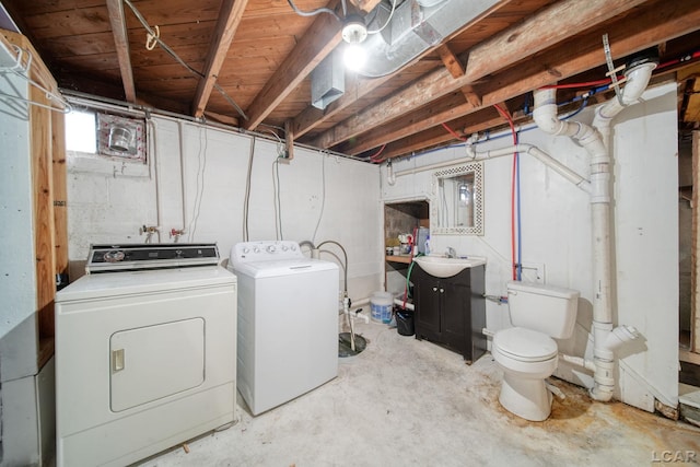 309 E Logan St, Tecumseh, MI 49286 - unfinished basement featuring separate washer and dryer and a sink