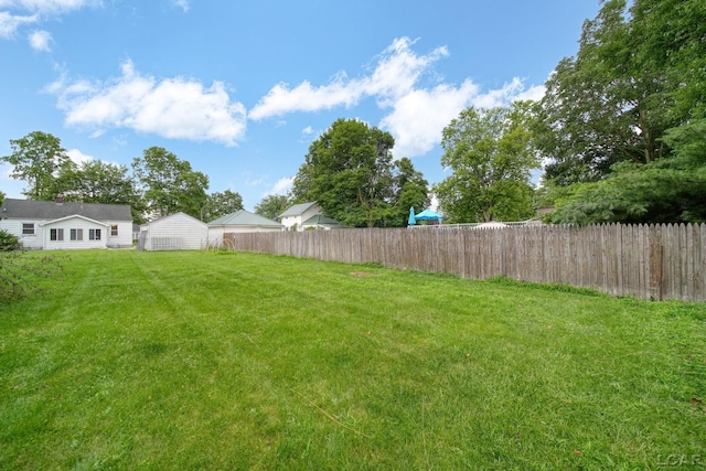 309 E Logan St, Tecumseh, MI 49286 - view of yard featuring a shed