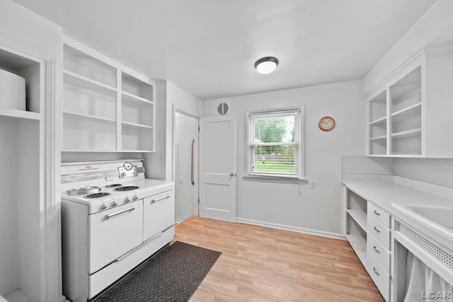 309 E Logan St, Tecumseh, MI 49286 - kitchen with electric range, open shelves, light countertops, white cabinets, and light wood-style floors