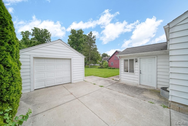 309 E Logan St, Tecumseh, MI 49286 - detached garage featuring driveway