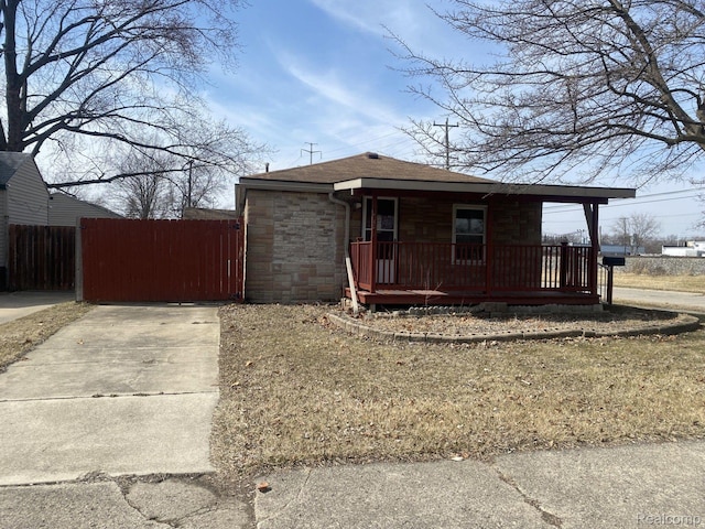 3512 Barry St, Wayne, MI 48184 - view of front of home featuring a porch, a gate, and a shingled roof
