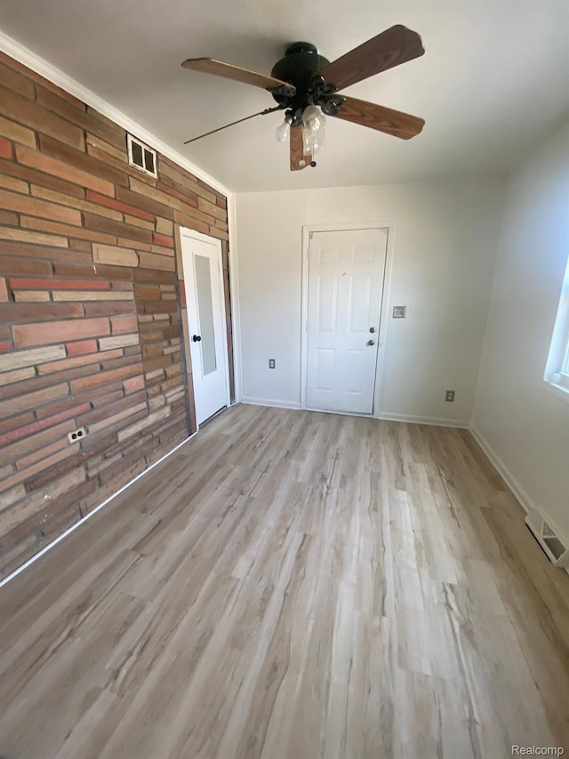 3512 Barry St, Wayne, MI 48184 - unfurnished room featuring a ceiling fan and light wood-style flooring