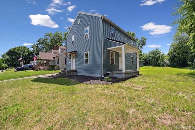 1516 Gainey Ave, Flint, MI 48503 - view of side of property with a yard and covered porch