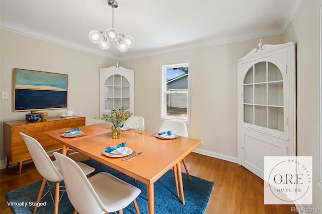 1516 Gainey Ave, Flint, MI 48503 - dining room with a chandelier, wood finished floors, and ornamental molding